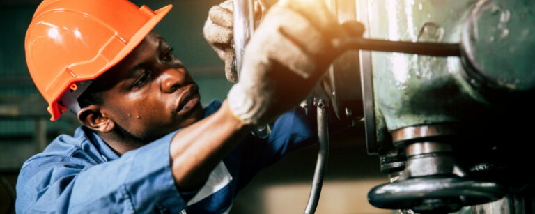 Engineer industry African man worker working and check on machin